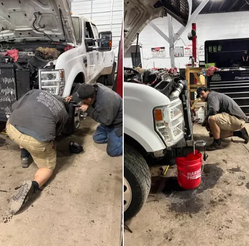 Fatboy mechanic working on a white truck in the repair shop